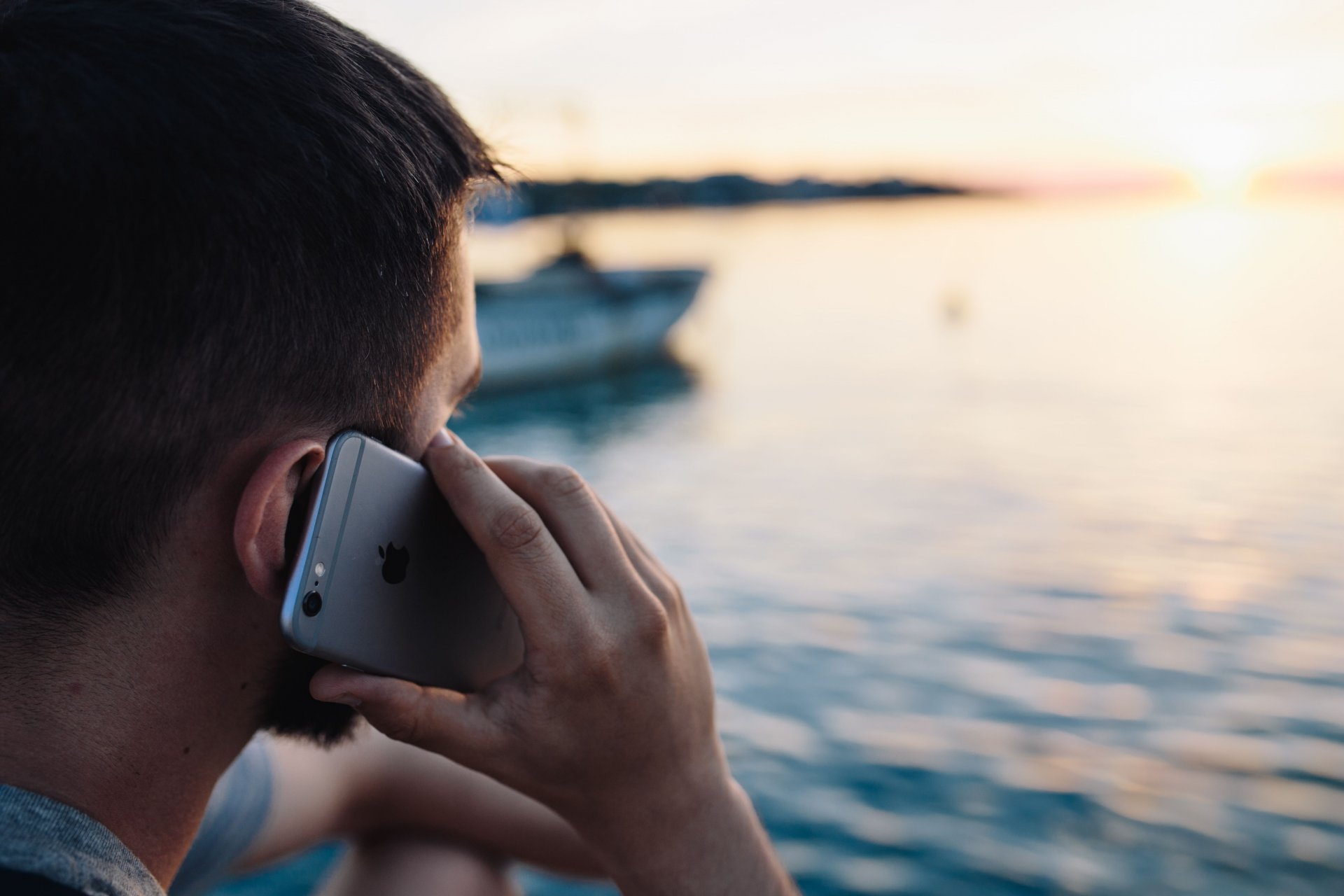 kaboompics_Mobile phone in mans hands near the sea (2).jpg