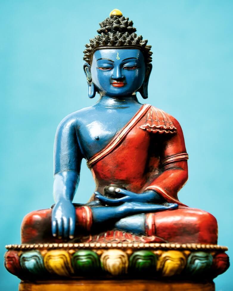 Cuadro en lienzo Buda color, fondo Azul.