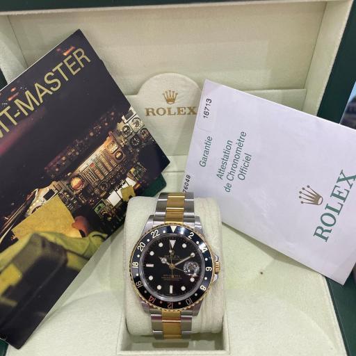 Rolex GMT ref.16713 from 2006 no holes case serial D black face steel gold [1]