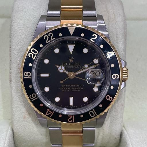 Rolex GMT ref.16713 from 2006 no holes case serial D black face steel gold