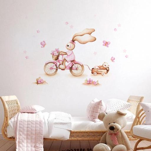 VINILO INFANTIL: Conejita con bici rosa, mariposas, flores y estrellas