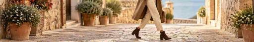 Botines de mujer marrones para otoño invierno con tacón cómodo en un look casual de estilo mediterráneo.