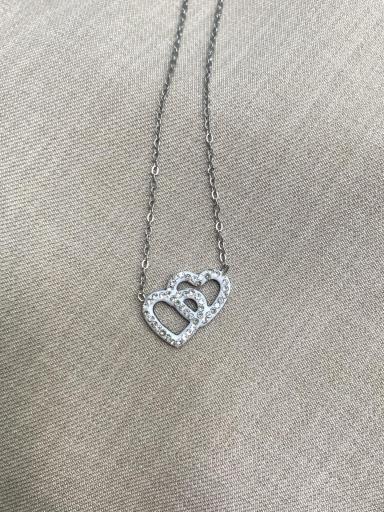 Collar de acero plateado con corazón doble entrelazado y pedrería