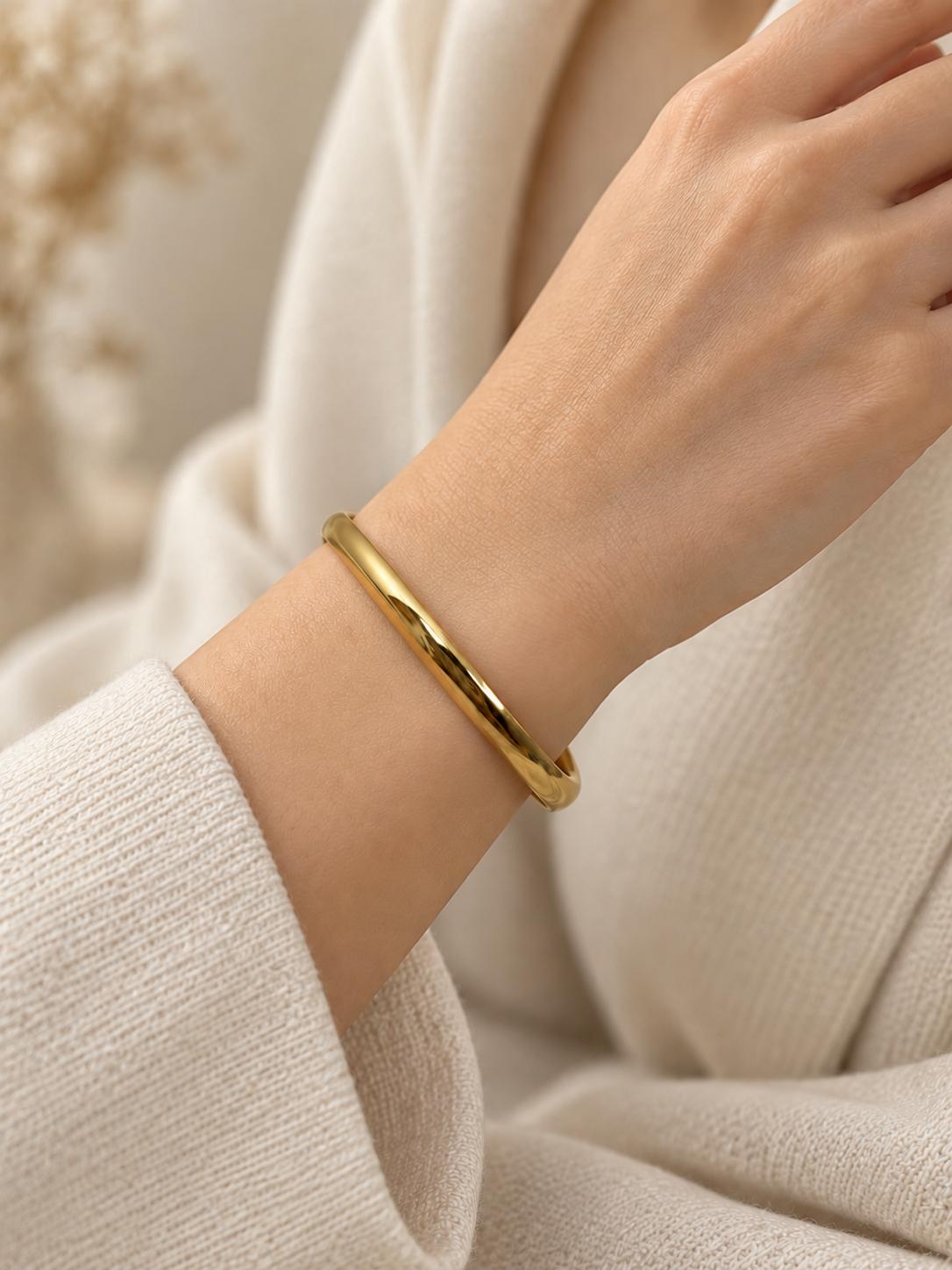 Pulsera aro de acero dorado para mujer