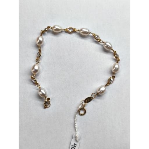 Pulsera oro 18K niña comunión con perlas ovaladas y circonitas