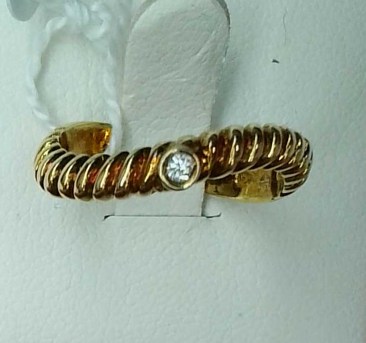Anillo oro amarillo 18K ondulado con diamante central para mujer