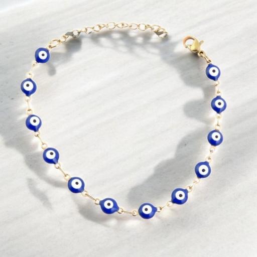  PULSERA DE ACERO INOXIDABLE  CON OJOS TURCOS AZUL DORADO.