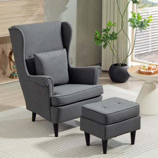 Sillón con Reposapiés Respaldo Alto Capitoné Patas de Madera Almohada Acolchada y Tapizado en Lino Gris