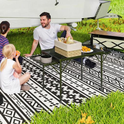 Mesa de Camping Plegable con Laterales Abatibles Altura Ajustable y Encimera Metálica de Rejilla 137x62x67 cm Negro